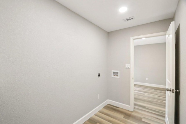 302 Martin Luther King St, Georgetown, TX 78626 - washroom with washer hookup, hookup for an electric dryer, light wood-type flooring, baseboards, and recessed lighting