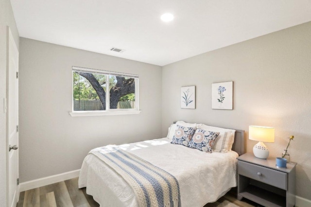 302 Martin Luther King St, Georgetown, TX 78626 - bedroom featuring wood finished floors, baseboards, and recessed lighting