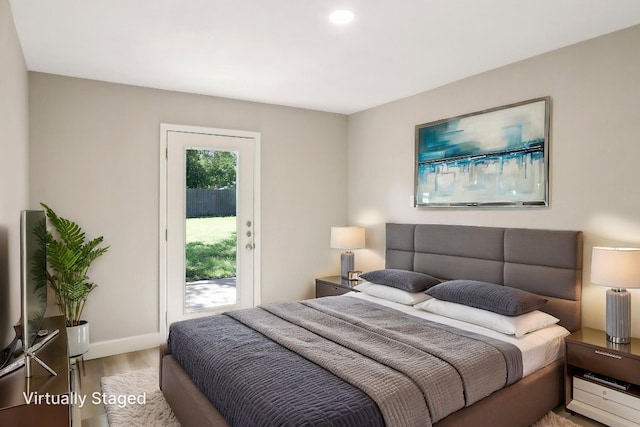 302 Martin Luther King St, Georgetown, TX 78626 - bedroom featuring access to outside, wood finished floors, and recessed lighting