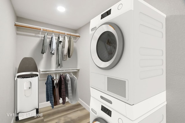 302 Martin Luther King St, Georgetown, TX 78626 - laundry area with stacked washer and clothes dryer, wood finished floors, and recessed lighting