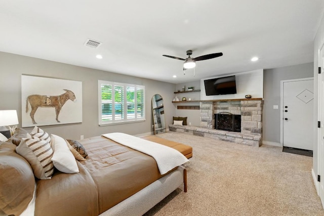 701 Nixon St, Lockhart, TX 78644 - bedroom with a stone fireplace, carpet flooring, recessed lighting, and baseboards