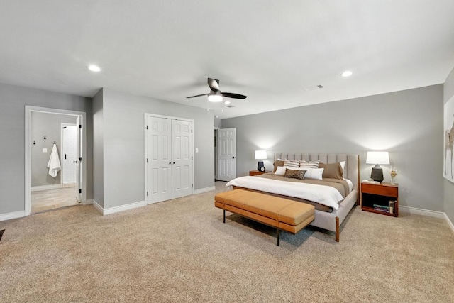 701 Nixon St, Lockhart, TX 78644 - bedroom with light colored carpet, baseboards, recessed lighting, ceiling fan, and connected bathroom