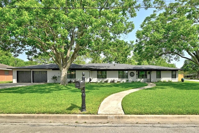 701 Nixon St, Lockhart, TX 78644 - single story home with a garage, a front yard, and driveway