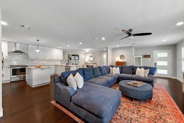 701 Nixon St, Lockhart, TX 78644 - living room with dark wood-type flooring, recessed lighting, and ceiling fan