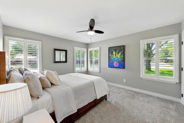 701 Nixon St, Lockhart, TX 78644 - bedroom featuring carpet floors, baseboards, and a ceiling fan