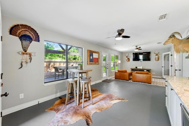 701 Nixon St, Lockhart, TX 78644 - dining area with baseboards and a ceiling fan