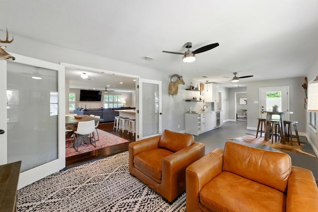 701 Nixon St, Lockhart, TX 78644 - living area featuring ceiling fan and baseboards