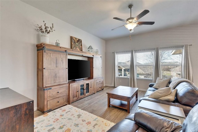 131 Mount Ellen St, Hutto, TX 78634 - living area with light wood-style floors, ceiling fan, and baseboards
