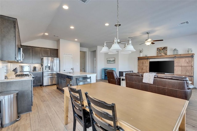 131 Mount Ellen St, Hutto, TX 78634 - dining space featuring vaulted ceiling, light wood-style flooring, recessed lighting, and ceiling fan