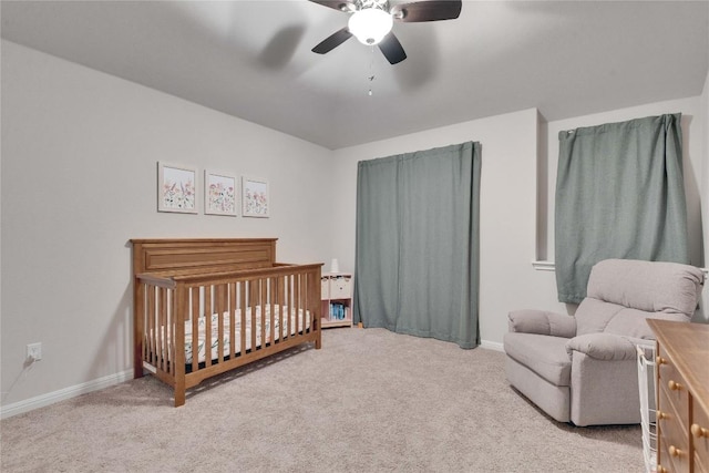 131 Mount Ellen St, Hutto, TX 78634 - bedroom featuring carpet, a nursery area, baseboards, and ceiling fan