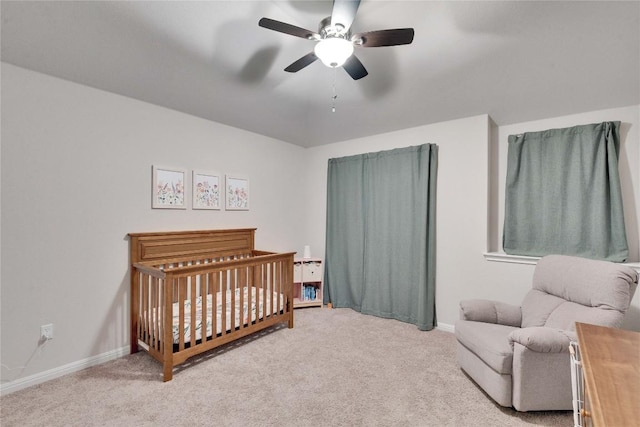 131 Mount Ellen St, Hutto, TX 78634 - carpeted bedroom with a nursery area, baseboards, and ceiling fan