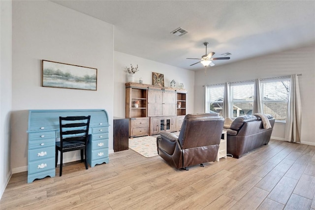 131 Mount Ellen St, Hutto, TX 78634 - living area with light wood finished floors, a ceiling fan, and baseboards