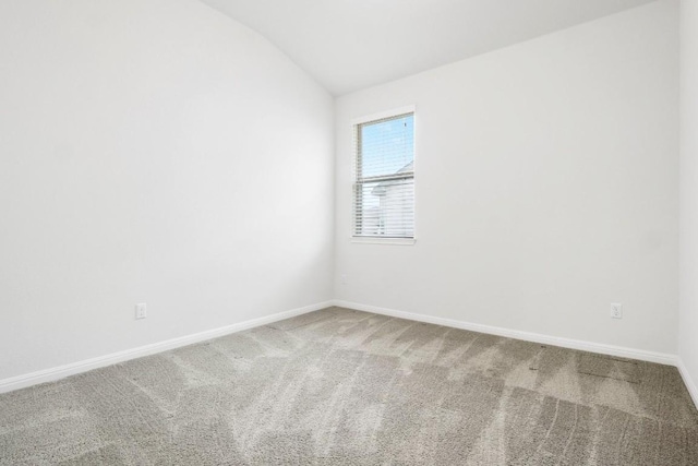 19201 Quebrada Dr, Pflugerville, TX 78660 - carpeted spare room with vaulted ceiling and baseboards