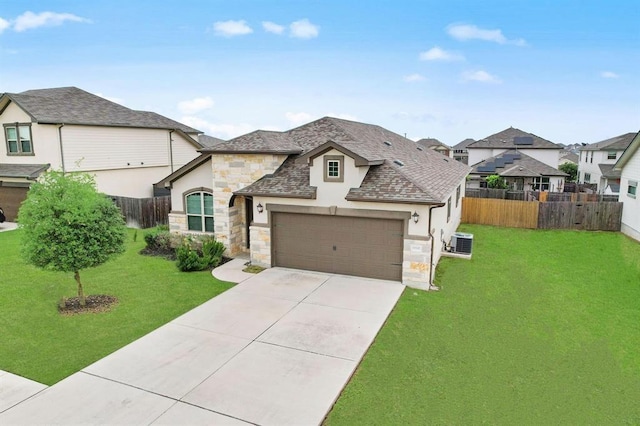 19201 Quebrada Dr, Pflugerville, TX 78660 - french country style house with stucco siding, stone siding, an attached garage, concrete driveway, and a residential view