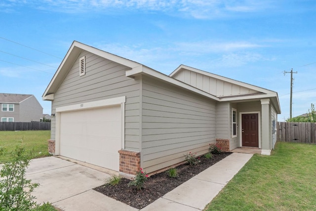 533 Peony Ct, Jarrell, TX 76537 - view of front of house with brick siding, a garage, and board and batten siding