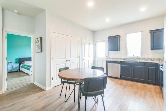 533 Peony Ct, Jarrell, TX 76537 - dining area featuring light wood finished floors, baseboards, and recessed lighting