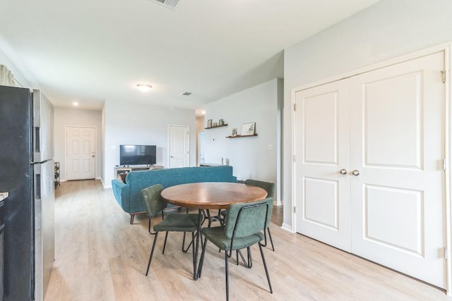 533 Peony Ct, Jarrell, TX 76537 - dining area featuring light wood finished floors and baseboards