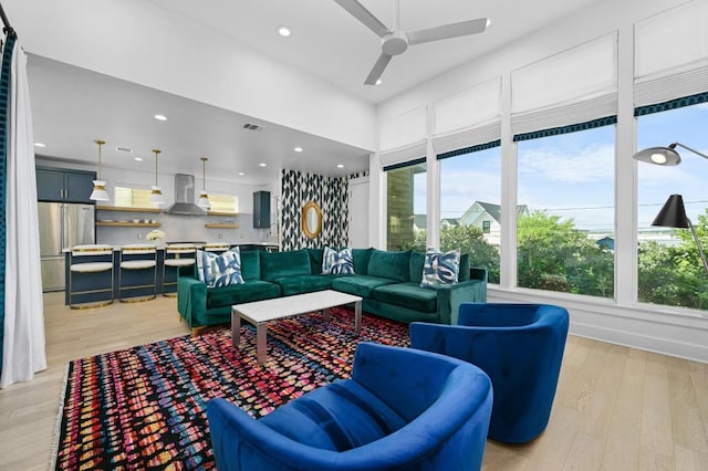 2002 E 8th St, Austin, TX 78702 - living room featuring ceiling fan, light wood finished floors, and recessed lighting