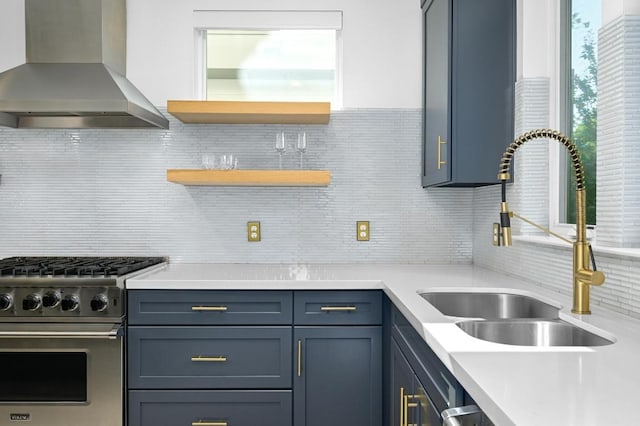 2002 E 8th St, Austin, TX 78702 - kitchen featuring wall chimney exhaust hood, premium range, a sink, backsplash, and plenty of natural light