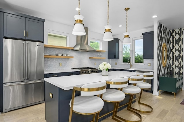2002 E 8th St, Austin, TX 78702 - kitchen with high quality fridge, open shelves, a center island, light countertops, and decorative backsplash