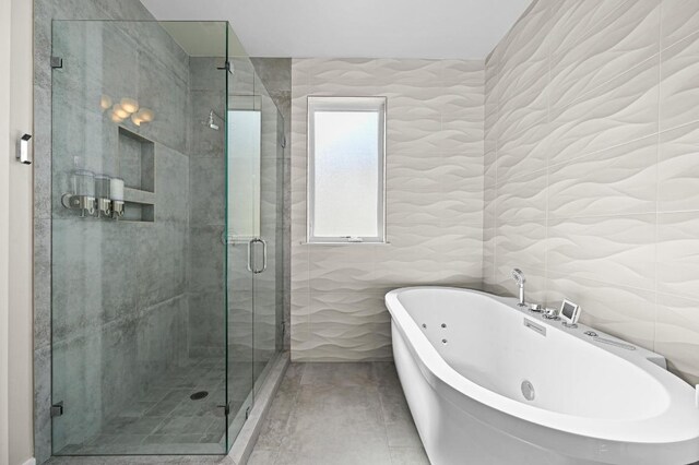 2002 E 8th St, Austin, TX 78702 - full bath featuring a soaking tub, tile walls, and a stall shower