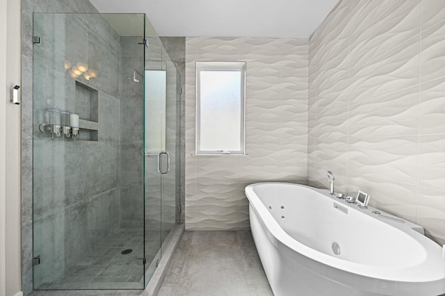 2002 E 8th St, Austin, TX 78702 - bathroom with a freestanding tub, tile walls, and a stall shower