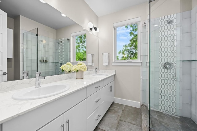 2002 E 8th St, Austin, TX 78702 - full bathroom with double vanity, a stall shower, and baseboards