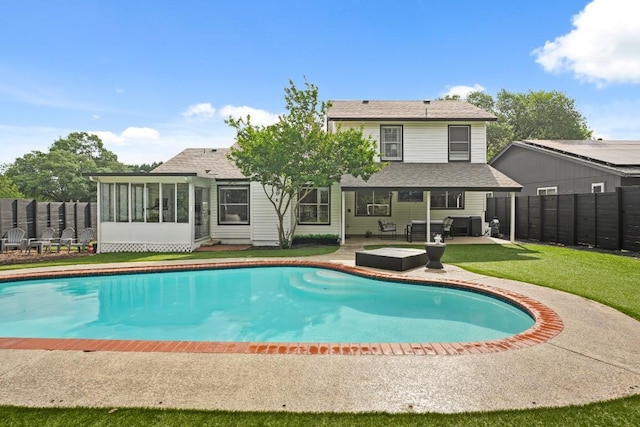 12308 Wycliff Ln, Austin, TX 78727 - view of swimming pool featuring a patio, a sunroom, and a fenced backyard