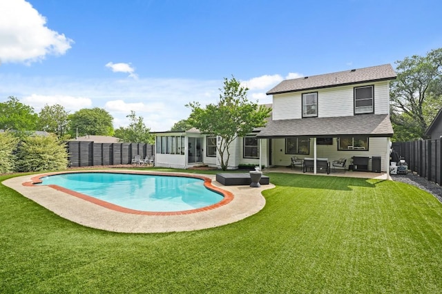 12308 Wycliff Ln, Austin, TX 78727 - back of house featuring a sunroom, a fenced backyard, a patio, and roof with shingles