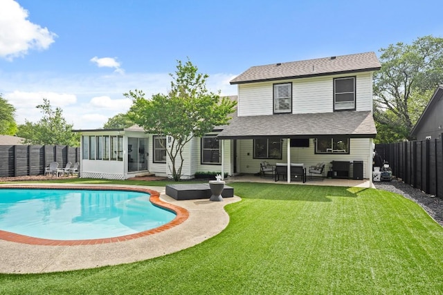 12308 Wycliff Ln, Austin, TX 78727 - rear view of property featuring a fenced backyard, a sunroom, roof with shingles, and a patio