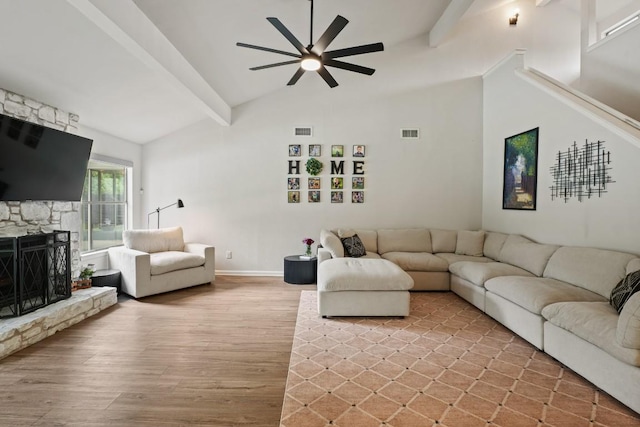 12308 Wycliff Ln, Austin, TX 78727 - living room featuring wood finished floors, a ceiling fan, and a fireplace