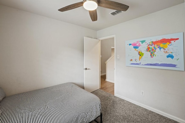 12308 Wycliff Ln, Austin, TX 78727 - carpeted bedroom with baseboards and a ceiling fan