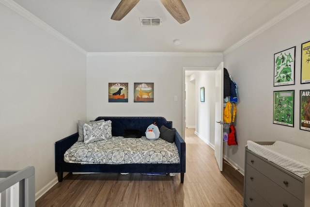 12308 Wycliff Ln, Austin, TX 78727 - bedroom featuring ornamental molding, wood finished floors, and ceiling fan