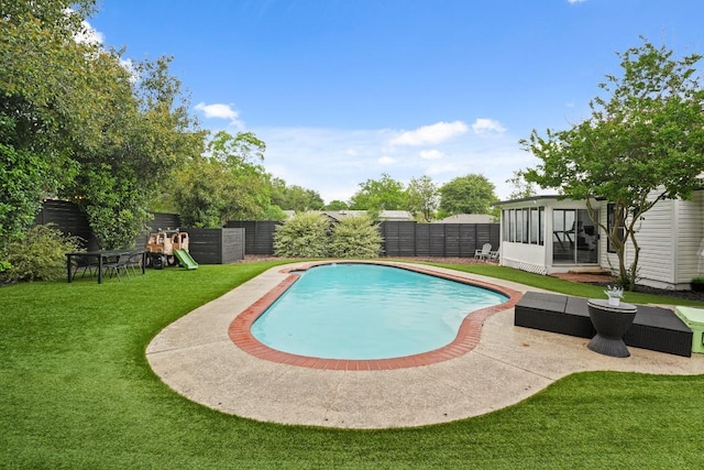 12308 Wycliff Ln, Austin, TX 78727 - view of pool with a fenced backyard, a sunroom, and a playground
