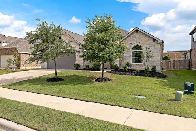 view of front of house featuring stone siding, an attached garage, and concrete driveway