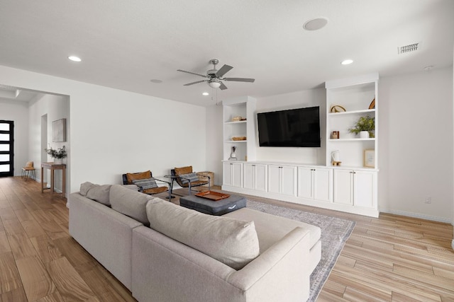 living room with light wood finished floors, recessed lighting, ceiling fan, and baseboards