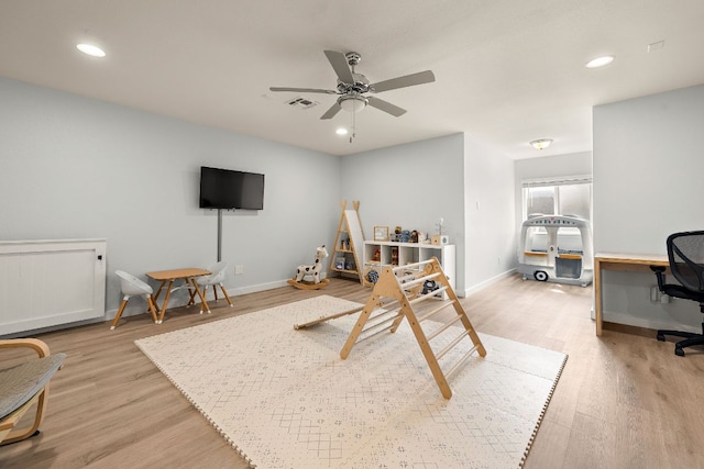 rec room with light wood finished floors, an office area, a ceiling fan, baseboards, and recessed lighting
