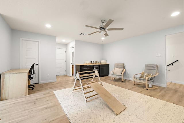 bedroom with an office area, baseboards, light wood-type flooring, recessed lighting, and ceiling fan