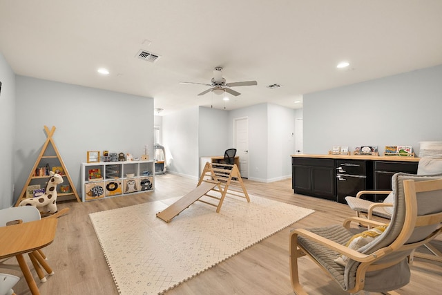 recreation room with ceiling fan, light wood-style floors, recessed lighting, and baseboards