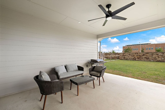 view of patio with ceiling fan, grilling area, and an outdoor living space