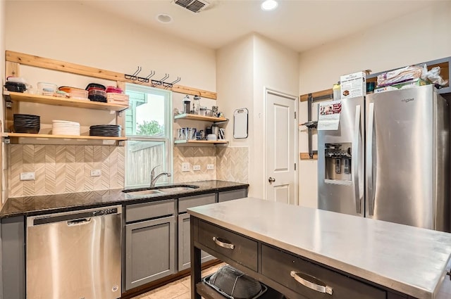 129 Bosque Dr, San Marcos, TX 78666 - kitchen featuring stainless steel appliances, a sink, open shelves, backsplash, and gray cabinetry