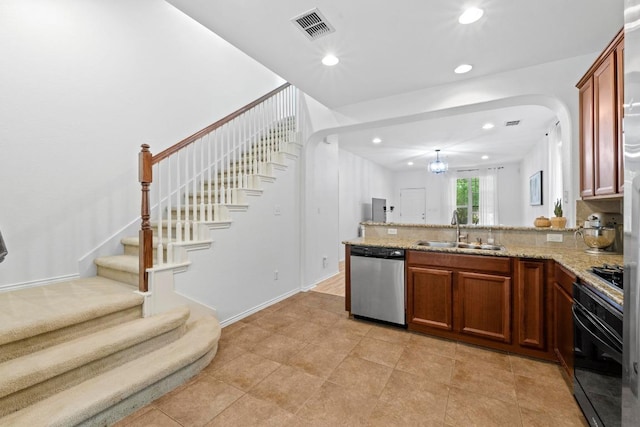 1121 Salem Park Ct, Austin, TX 78745 - kitchen featuring dishwasher, oven, a sink, brown cabinets, and recessed lighting