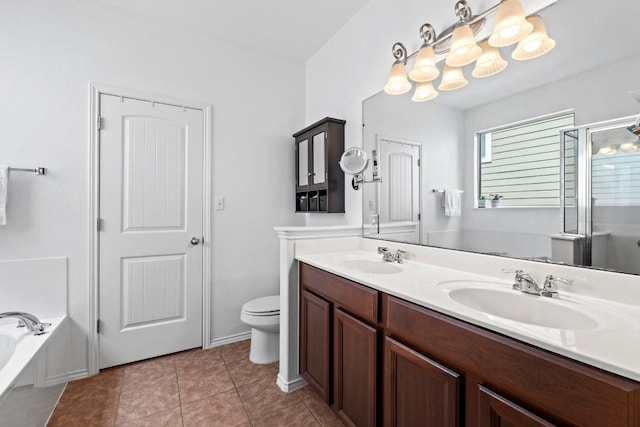 1121 Salem Park Ct, Austin, TX 78745 - bathroom with double vanity, toilet, a shower stall, a garden tub, and tile patterned flooring