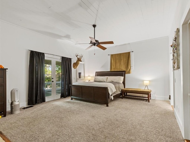 bedroom with access to exterior, carpet flooring, and baseboards