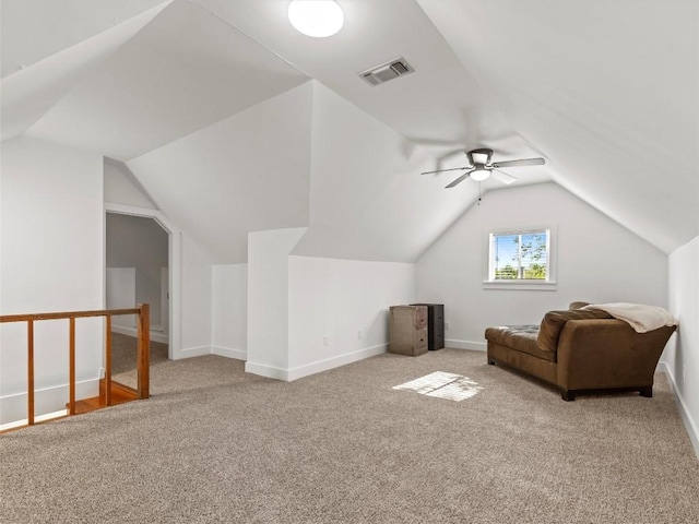 additional living space featuring carpet floors, lofted ceiling, a ceiling fan, and baseboards