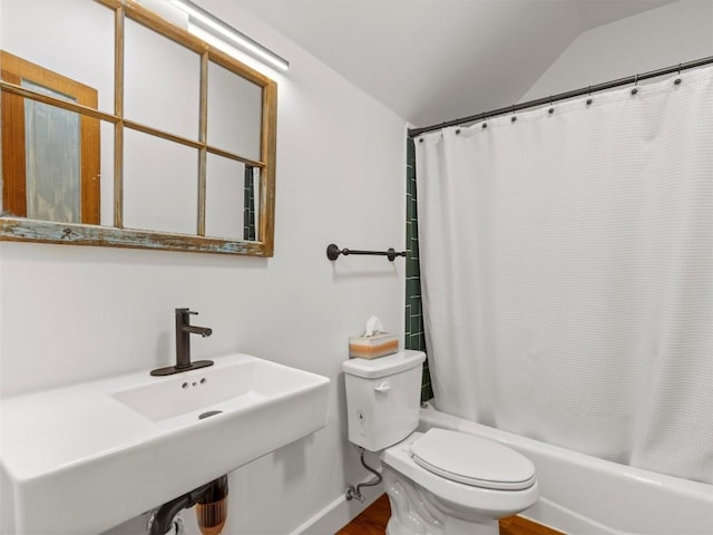 full bath featuring toilet, lofted ceiling, shower / tub combo with curtain, and wood finished floors