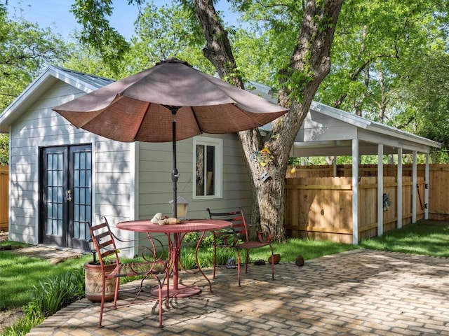 back of property featuring fence, a patio area, and french doors