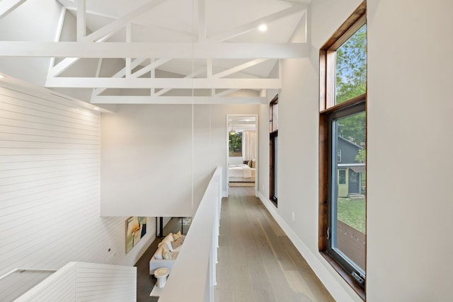 607 Terrell Hill Dr Unit B, Austin, TX 78704 - hall with healthy amount of natural light, high vaulted ceiling, wood finished floors, wooden walls, and beamed ceiling