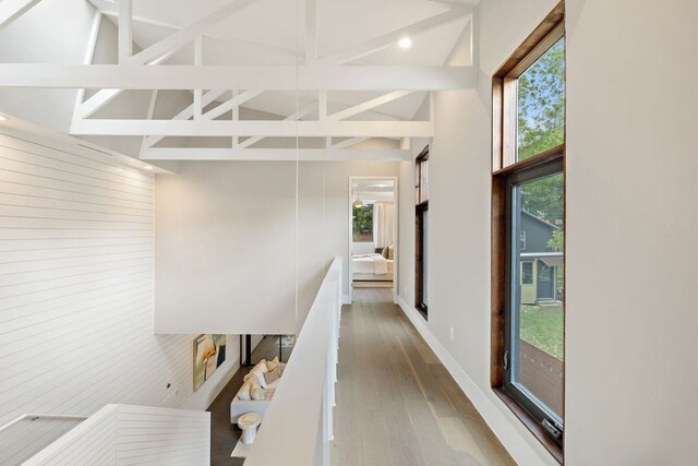 607 Terrell Hill Dr Unit B, Austin, TX 78704 - corridor with plenty of natural light, a high ceiling, wood finished floors, wooden walls, and recessed lighting