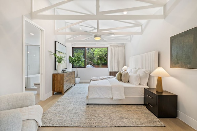607 Terrell Hill Dr Unit B, Austin, TX 78704 - bedroom with light wood finished floors, connected bathroom, and baseboards